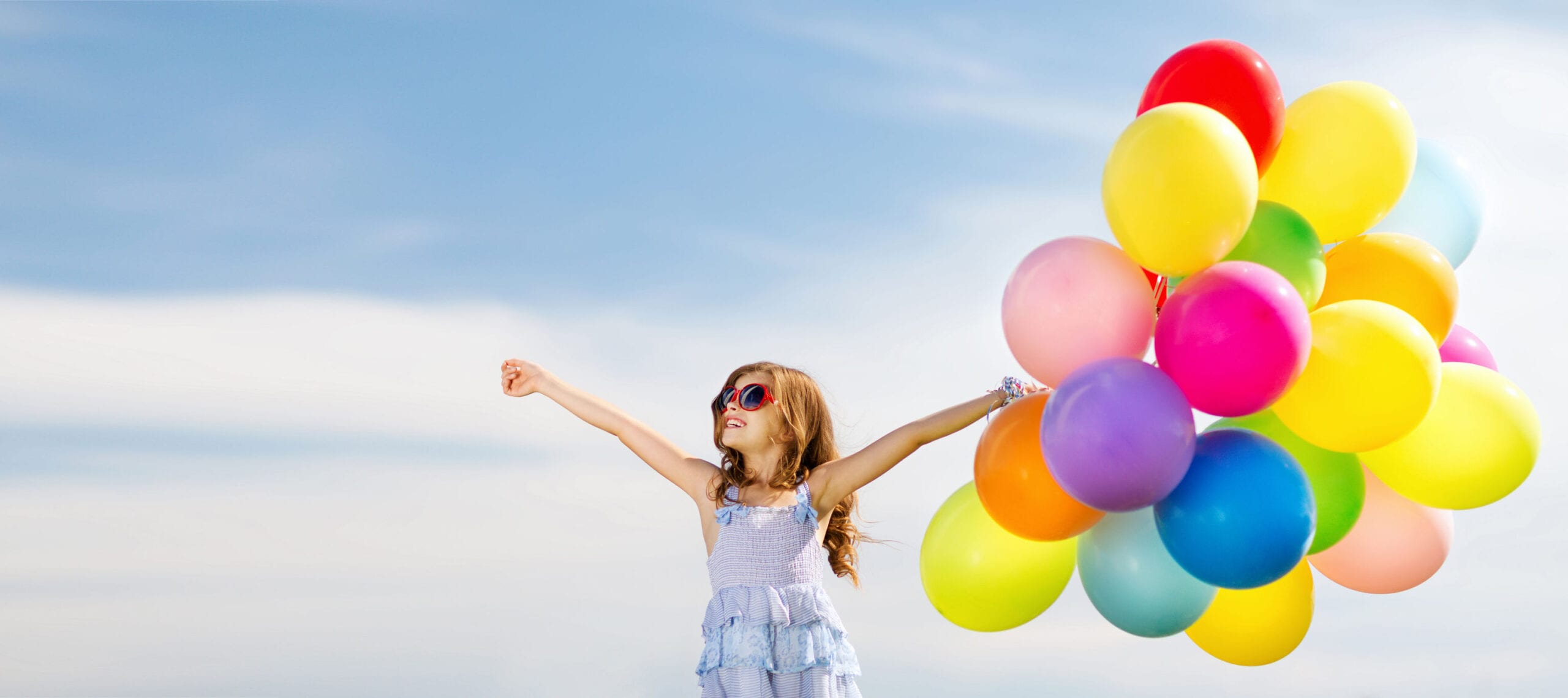 happy girl with colorful balloons
